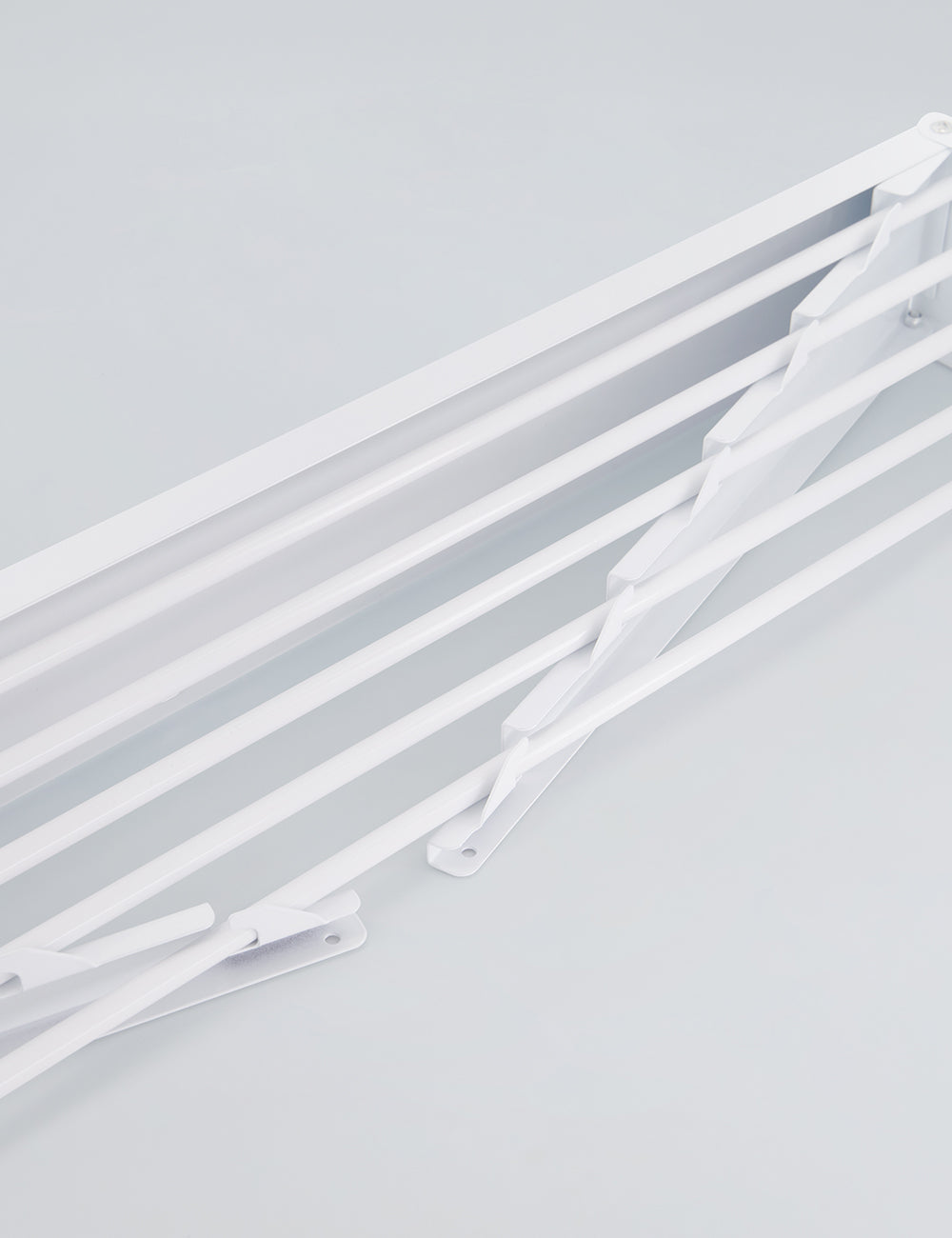 Tendedero de pared plegable para interiores y exteriores.
