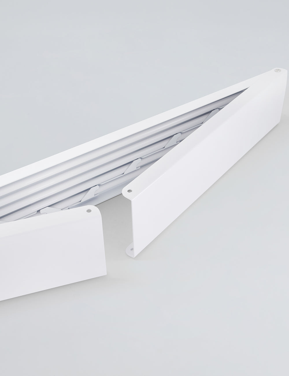 Tendedero de pared plegable para interiores y exteriores.