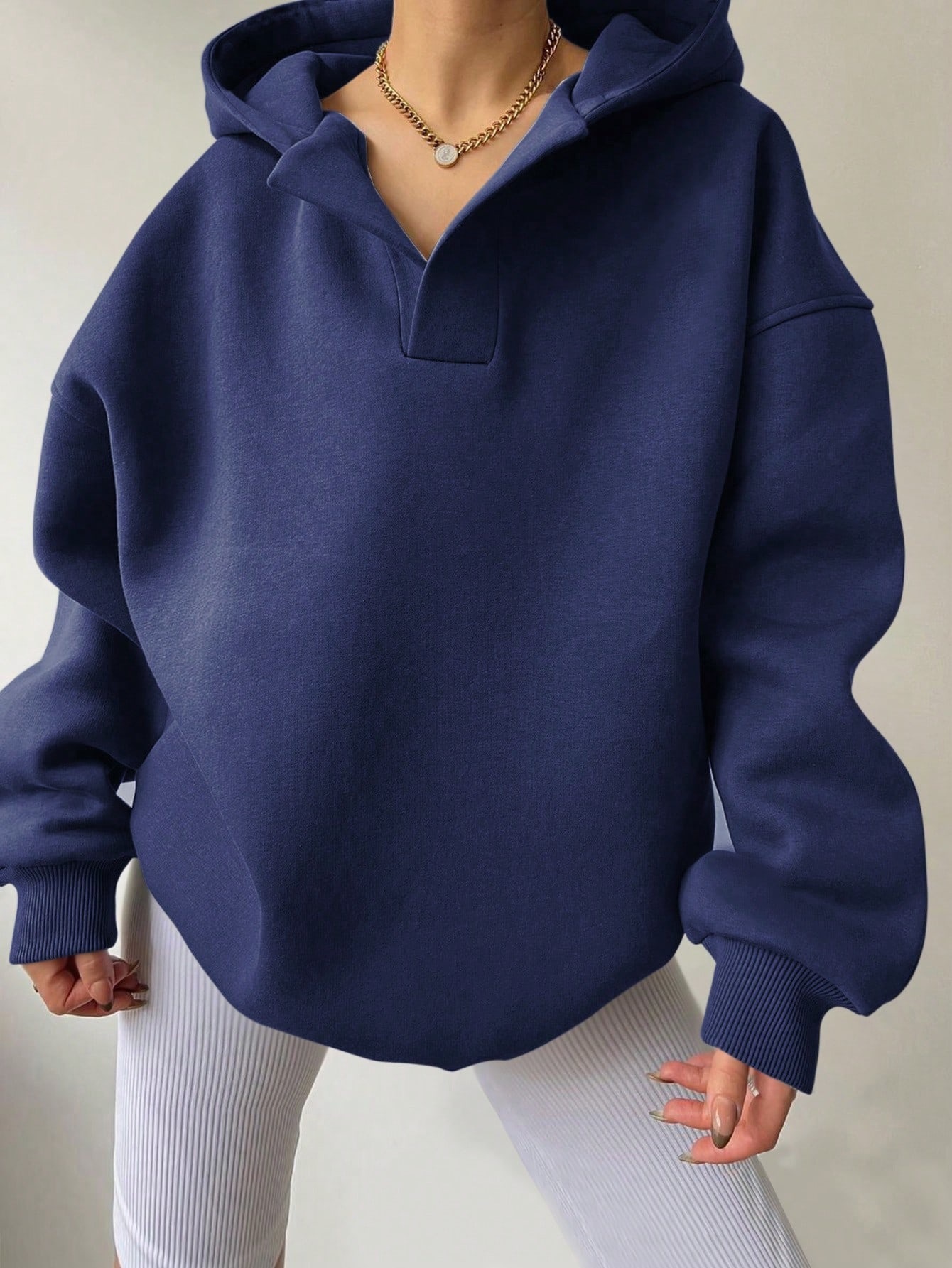 Fleece-Lined Hooded Sweatshirt with Ribbed Cuffs and Solid Color Design