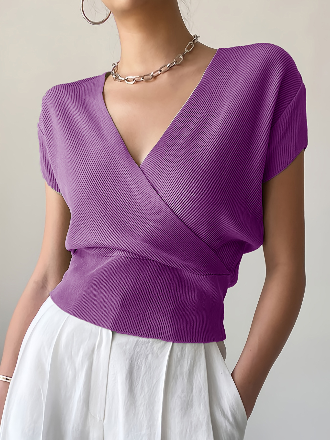 Women's Solid Knit Top with Cross V-Neck and Waist-Defining Design