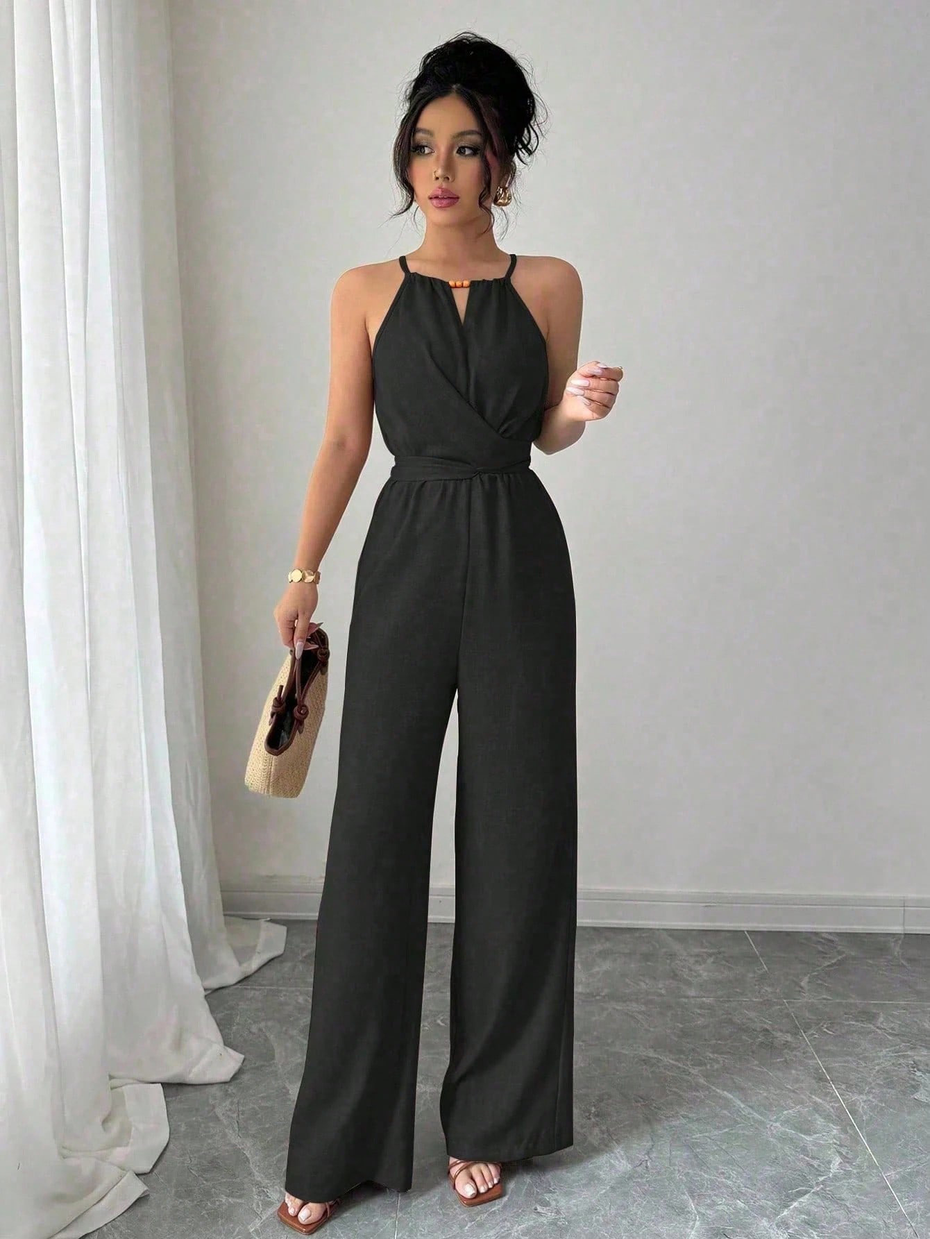 Women's Halter Neck Sleeveless Jumpsuit with Cinched Waist and Flowing Drape