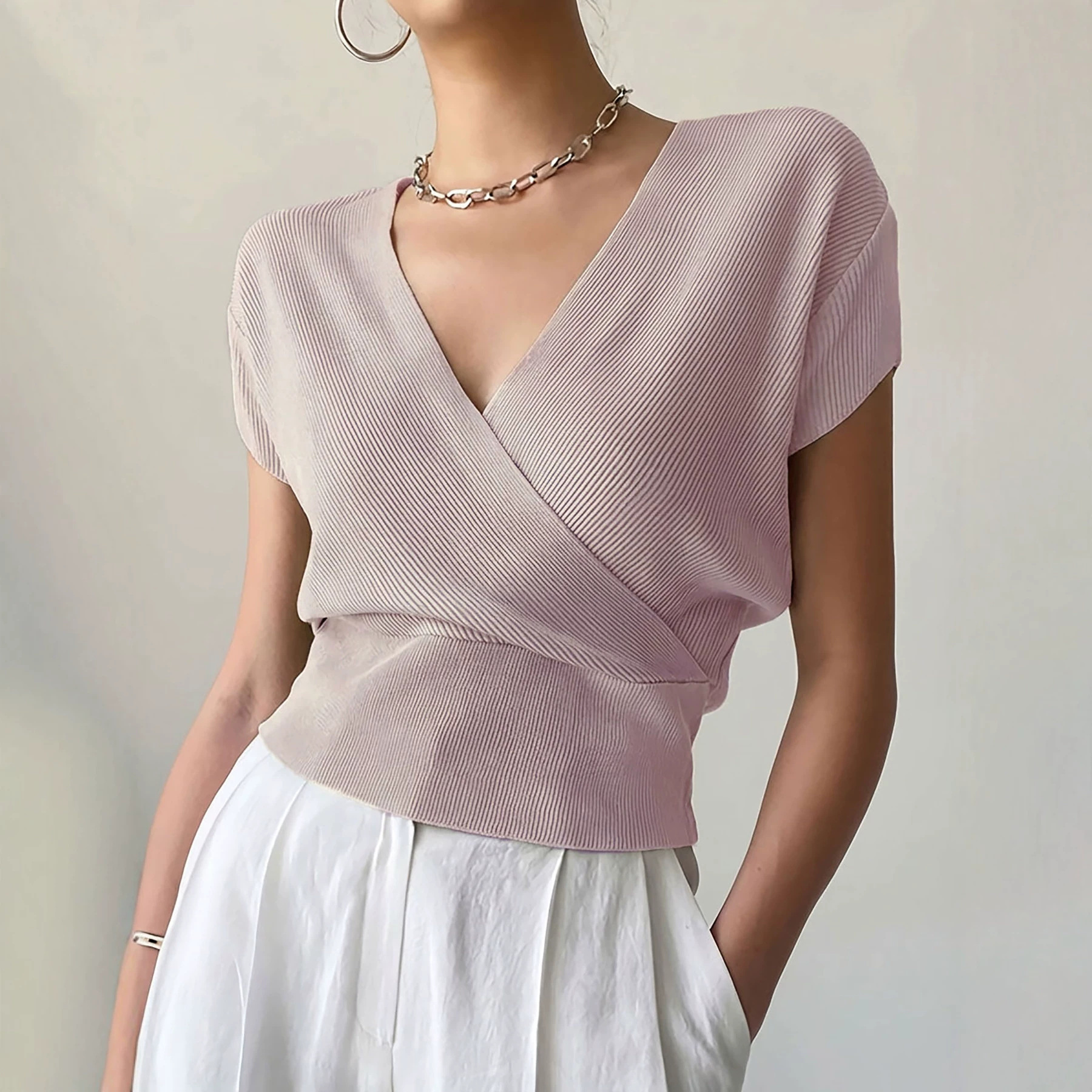 Women's Solid Knit Top with Cross V-Neck and Waist-Defining Design