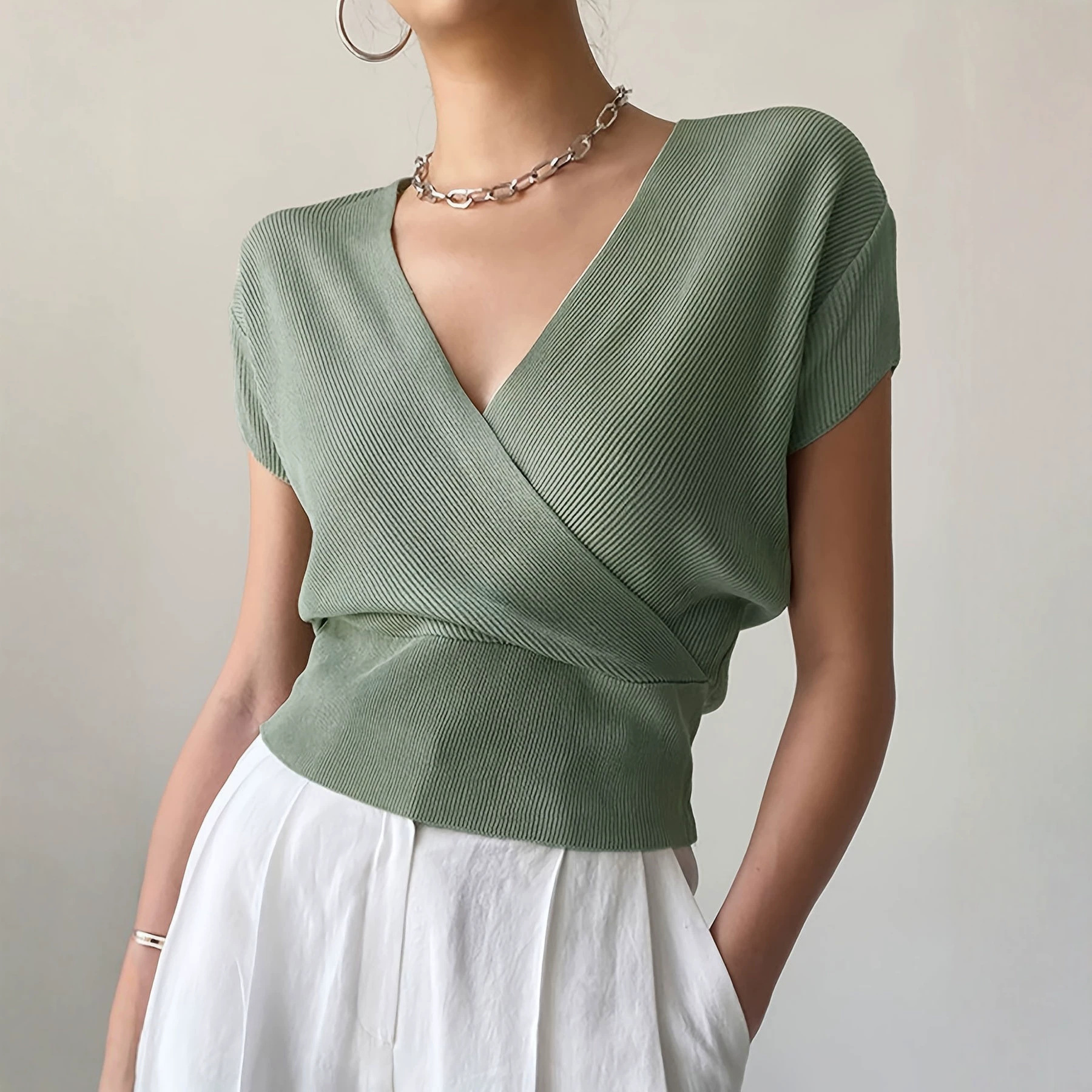 Women's Solid Knit Top with Cross V-Neck and Waist-Defining Design