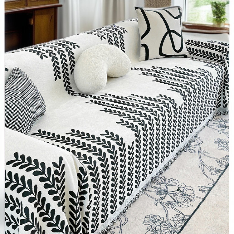 Leaf pattern chenille towel enhancing couch decor