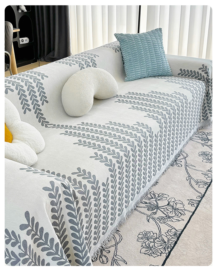 Non-skidding sofa cover in stylish leaf design