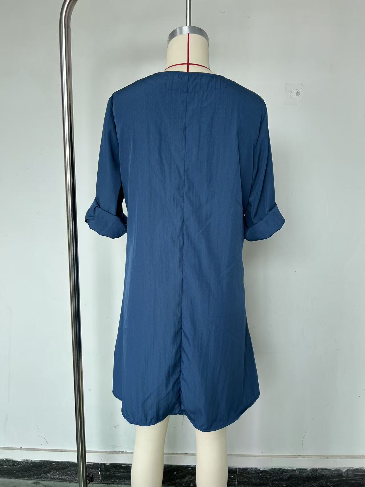 Pleated solid-color maxi dress, model wearing outdoor lifestyle photo showing full silhouette