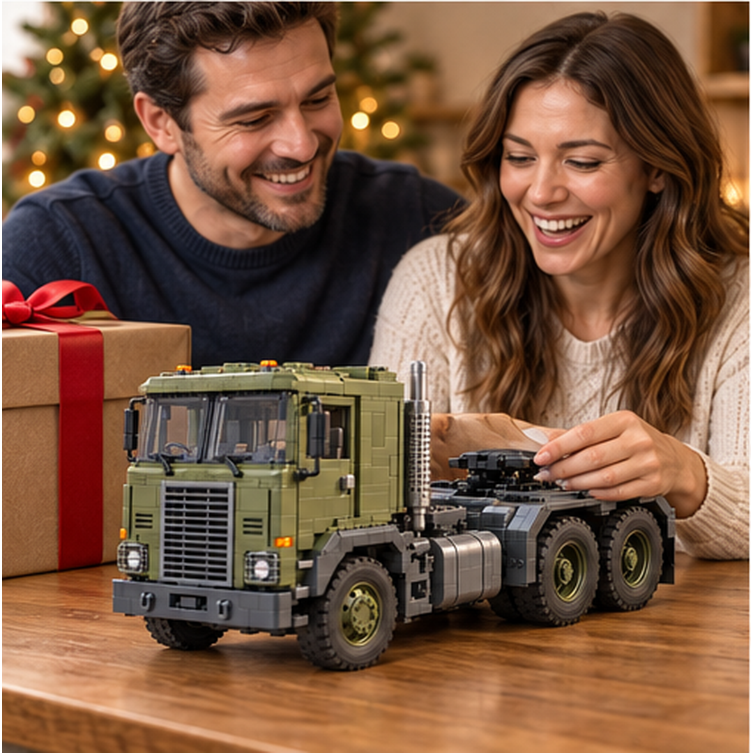Two adults admiring the British Iron Hauler brick building set beside a wrapped gift