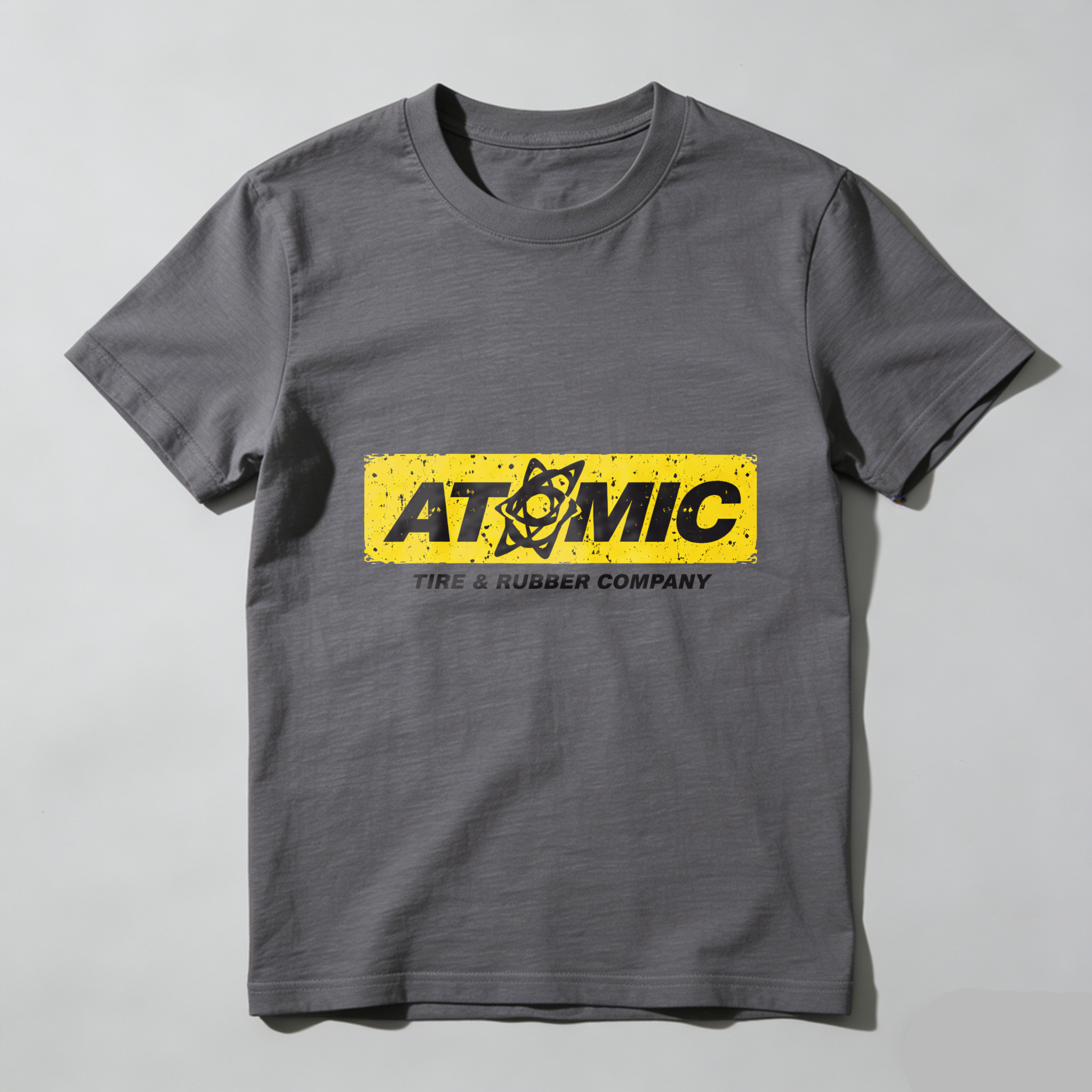 Atomic Tire Rubber Company Black T Shirt With Yellow Logo Design
