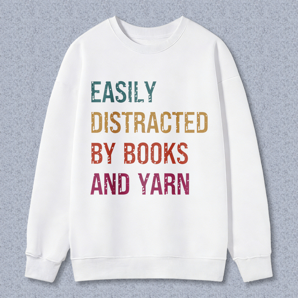 Wardrobecart Easily Distracted By Books And Yarn Unisex Classic Sweatshirt
