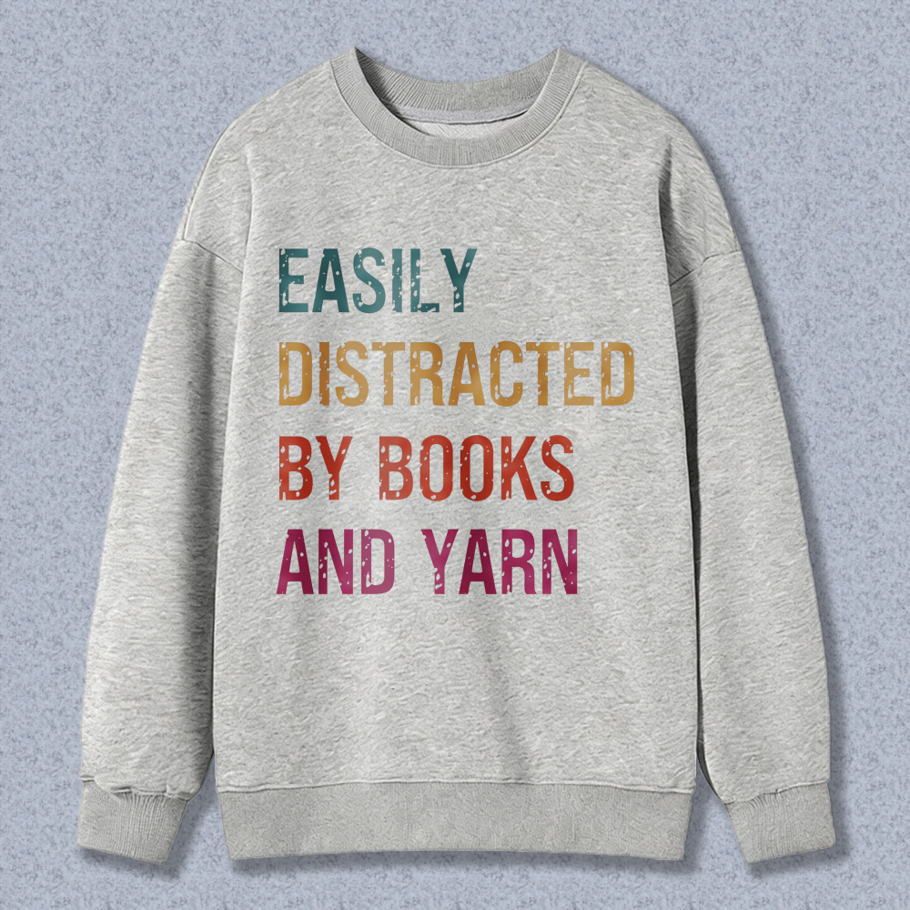 Wardrobecart Easily Distracted By Books And Yarn Unisex Classic Sweatshirt