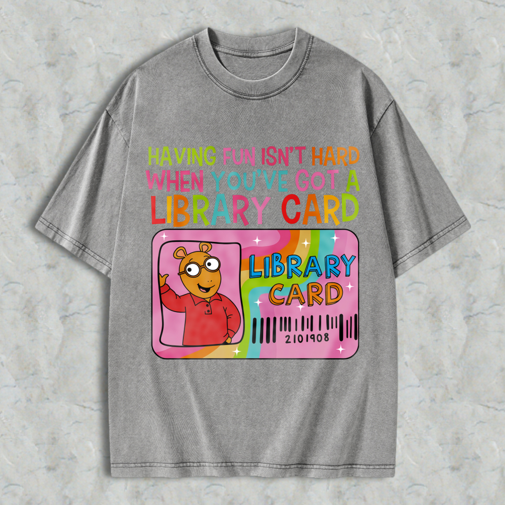 Wardrobecart Having Fun Isn't Hard When You've Got A Library Card With Cartoon Character And Rainbow Design Unisex Washed T-shirt