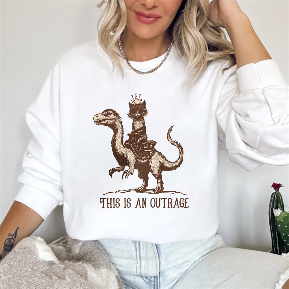 Wardrobecart Cat Riding Dinosaur With Crown And Text This Is An Outrage Unisex Classic Sweatshirt