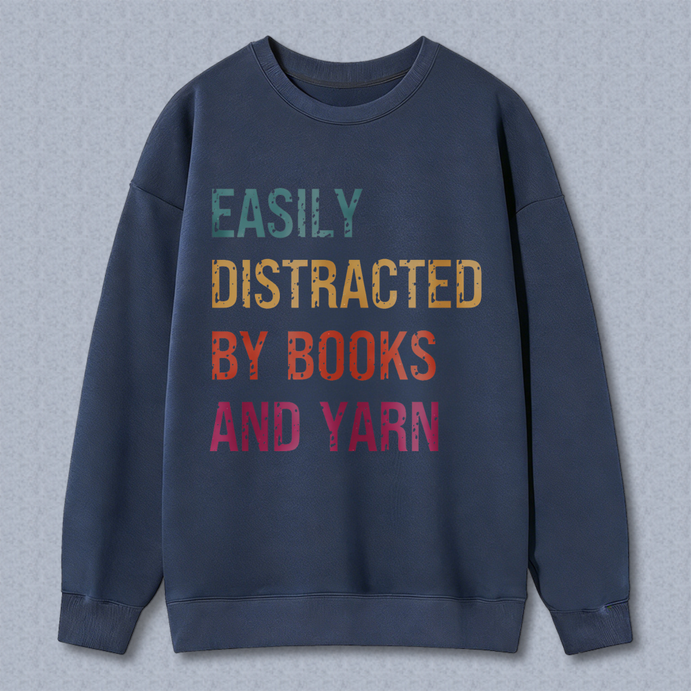 Wardrobecart Easily Distracted By Books And Yarn Unisex Classic Sweatshirt