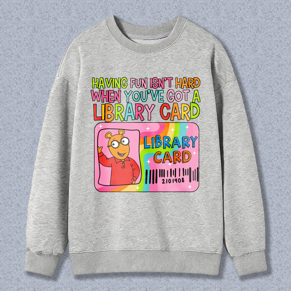 Wardrobecart Having Fun Isn't Hard When You've Got A Library Card With Cartoon Character And Rainbow Design Unisex Classic Sweatshirt