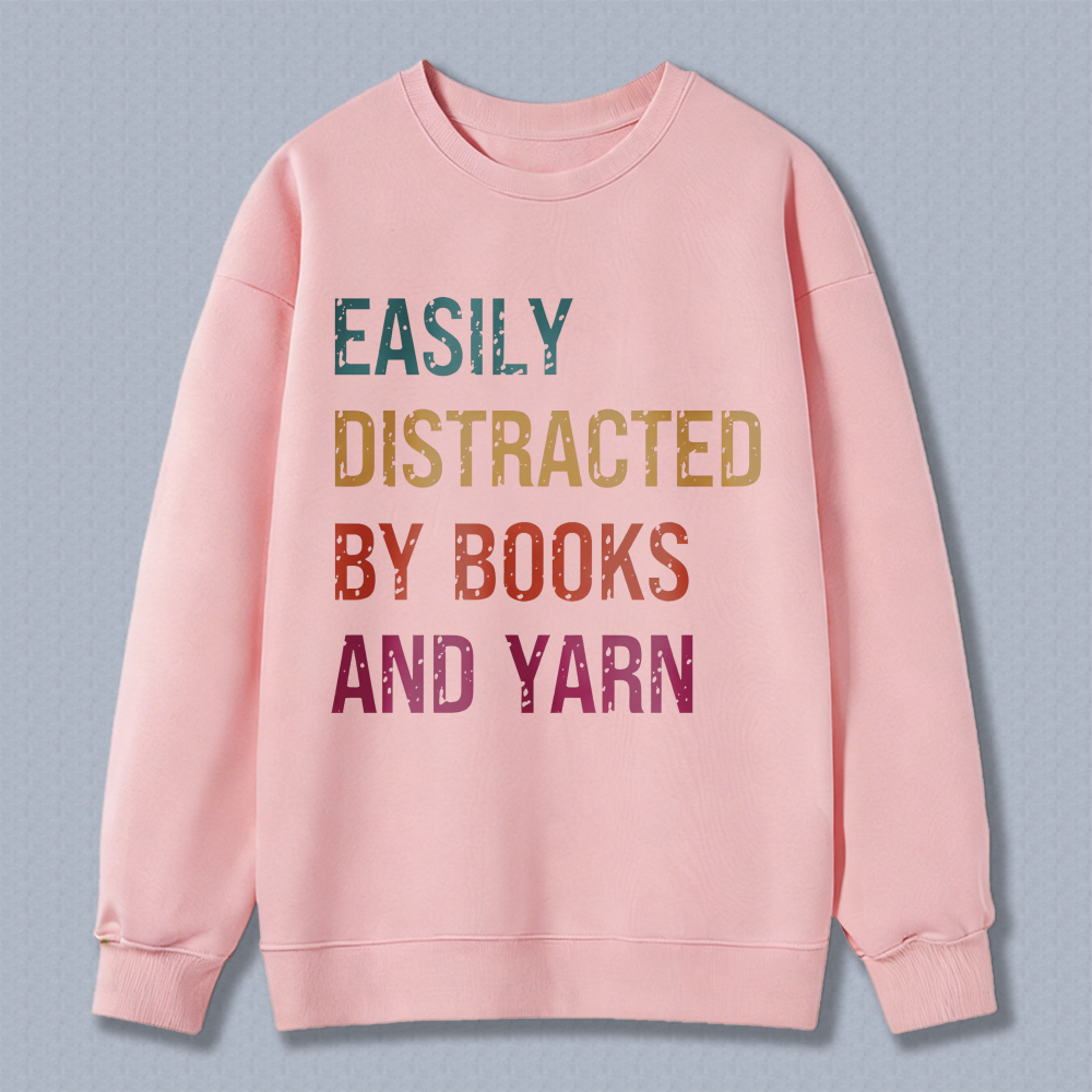 Wardrobecart Easily Distracted By Books And Yarn Unisex Classic Sweatshirt