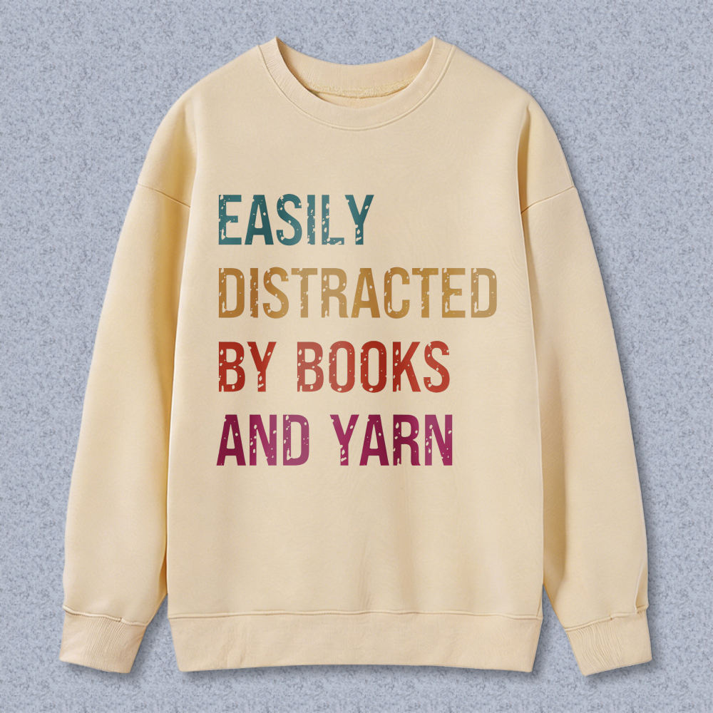 Wardrobecart Easily Distracted By Books And Yarn Unisex Classic Sweatshirt