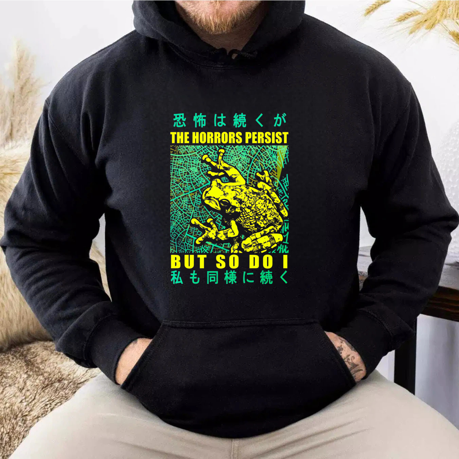 The Horrors Persist But So Do I Frog Hoodie With Japanese Text And Neon Design
