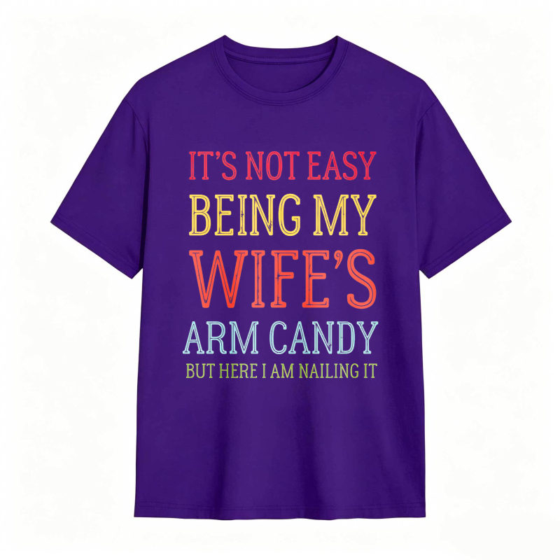 Dorawear™ Its Not Easy Being My Wifes Arm Candy But Here I Am Nailing It Unisex Classic T-shirt