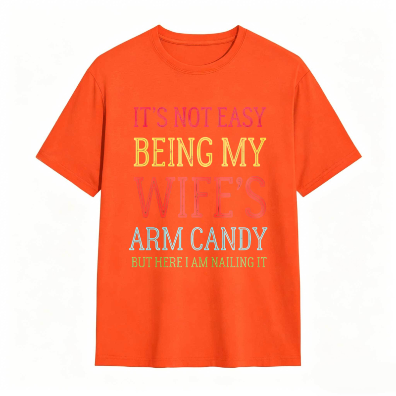 Dorawear™ Its Not Easy Being My Wifes Arm Candy But Here I Am Nailing It Unisex Classic T-shirt