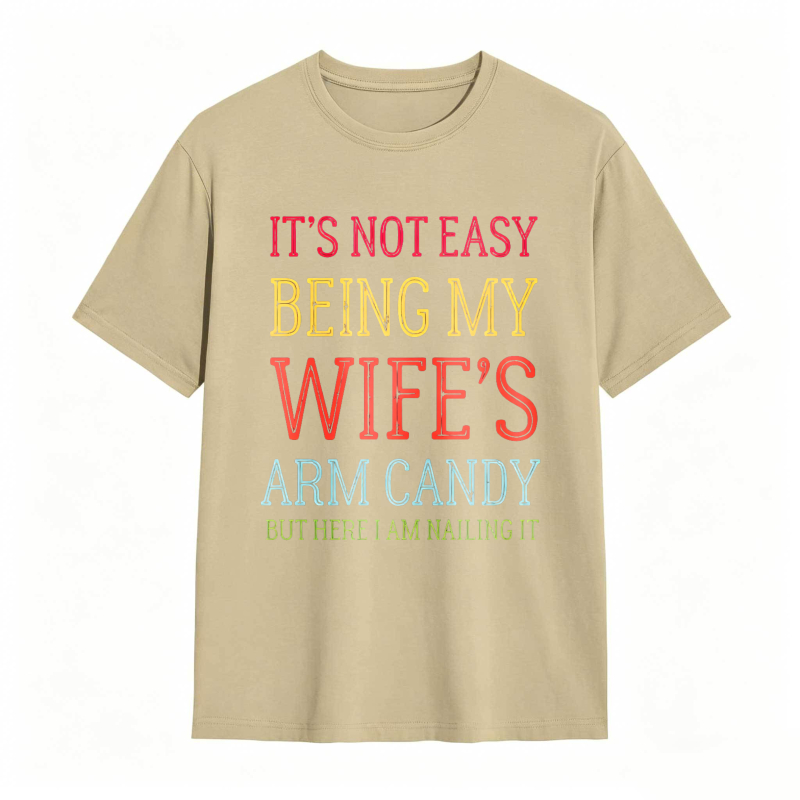 Dorawear™ Its Not Easy Being My Wifes Arm Candy But Here I Am Nailing It Unisex Classic T-shirt