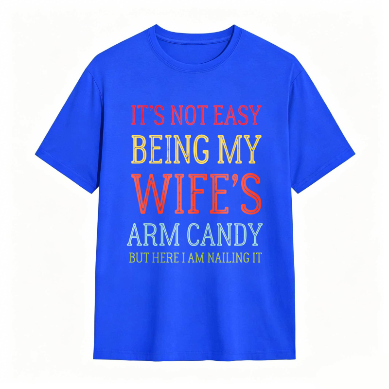 Dorawear™ Its Not Easy Being My Wifes Arm Candy But Here I Am Nailing It Unisex Classic T-shirt