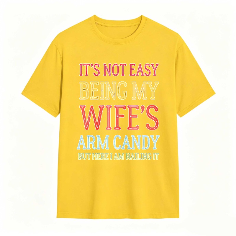 Dorawear™ Its Not Easy Being My Wifes Arm Candy But Here I Am Nailing It Unisex Classic T-shirt