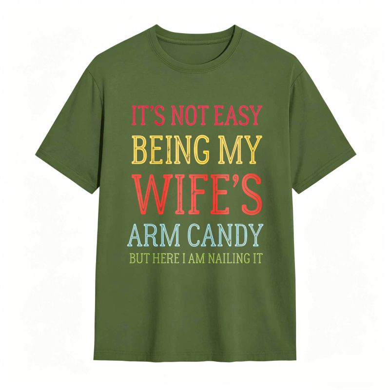 Dorawear™ Its Not Easy Being My Wifes Arm Candy But Here I Am Nailing It Unisex Classic T-shirt