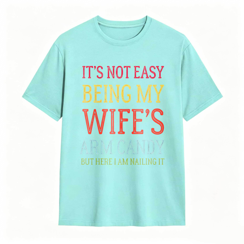 Dorawear™ Its Not Easy Being My Wifes Arm Candy But Here I Am Nailing It Unisex Classic T-shirt