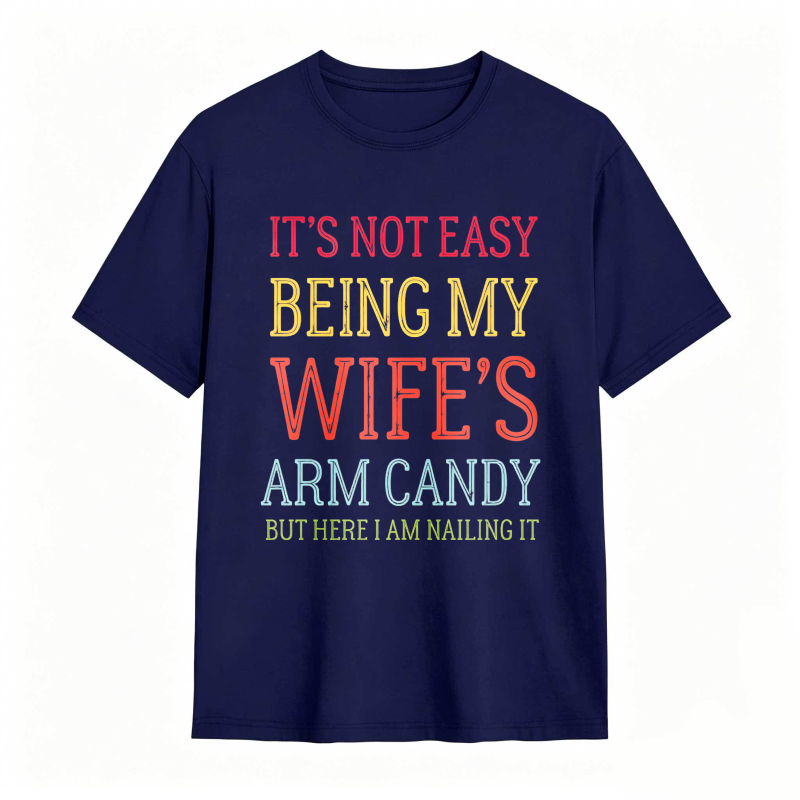 Dorawear™ Its Not Easy Being My Wifes Arm Candy But Here I Am Nailing It Unisex Classic T-shirt