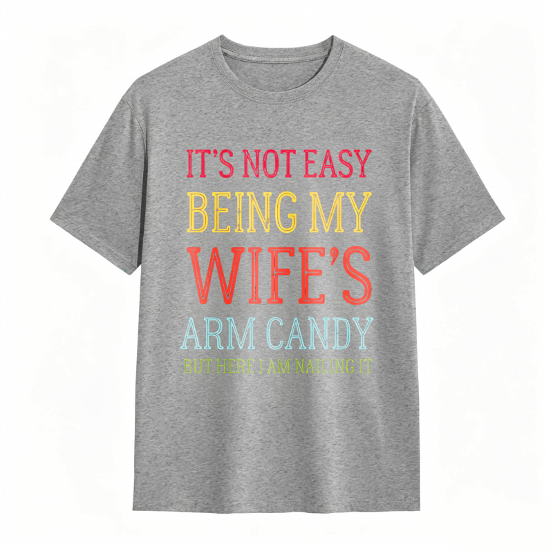 Dorawear™ Its Not Easy Being My Wifes Arm Candy But Here I Am Nailing It Unisex Classic T-shirt