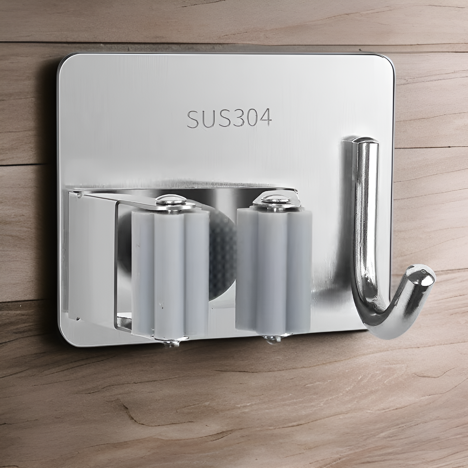 Space-saving stainless steel broom and mop clip