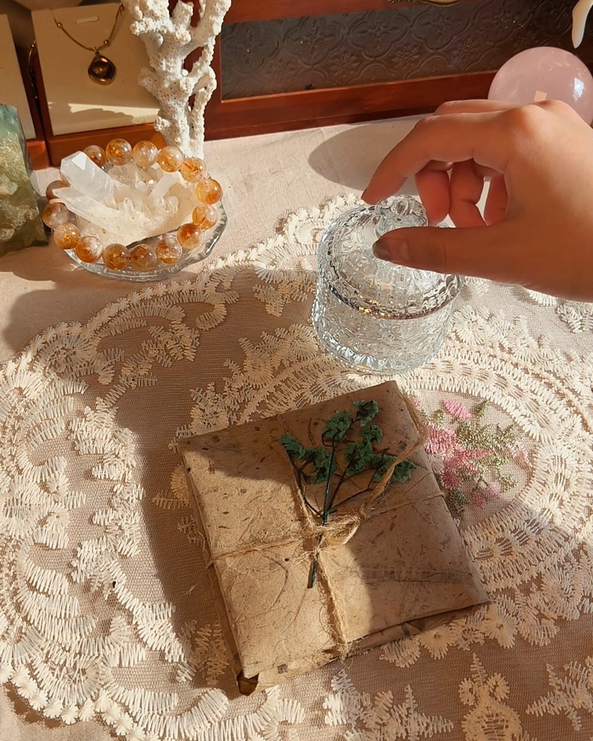 Kraft paper, twine and a jar of clear quartz chips on our packing table