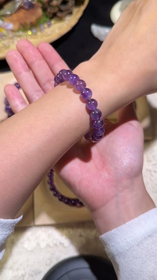 A crystal bead bracelet worn on the wrist, photographed by Stone Whisper