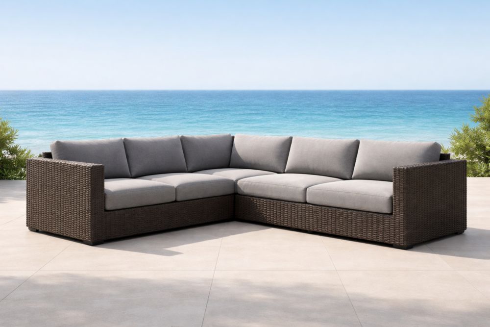 Divano angolare da esterno in rattan e cuscini in poliestere