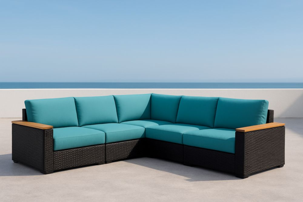 Divano angolare da esterno in rattan con cuscini turchesi e struttura in alluminio