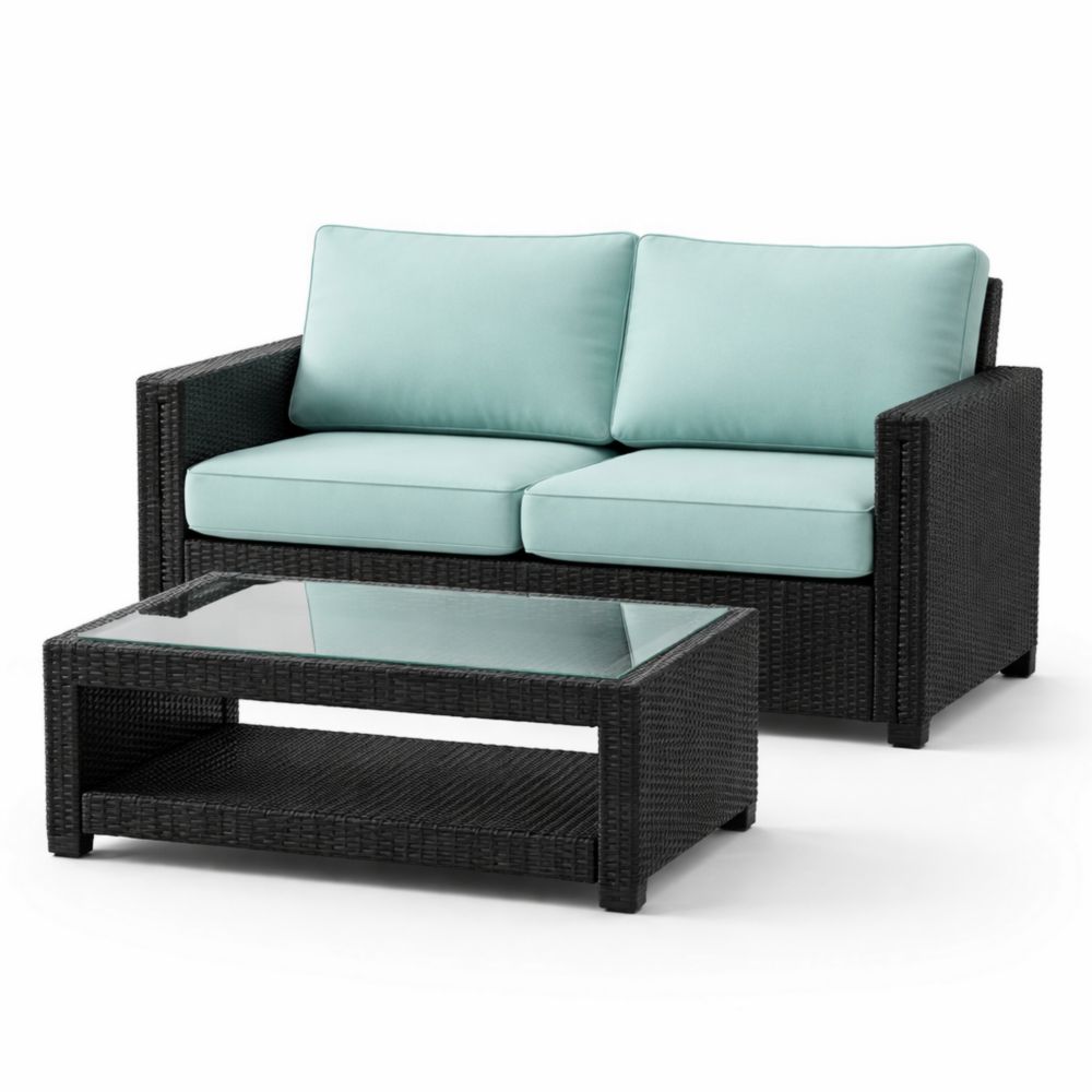 Ensemble canapé 2 places en résine avec coussins en polyester et table basse en verre