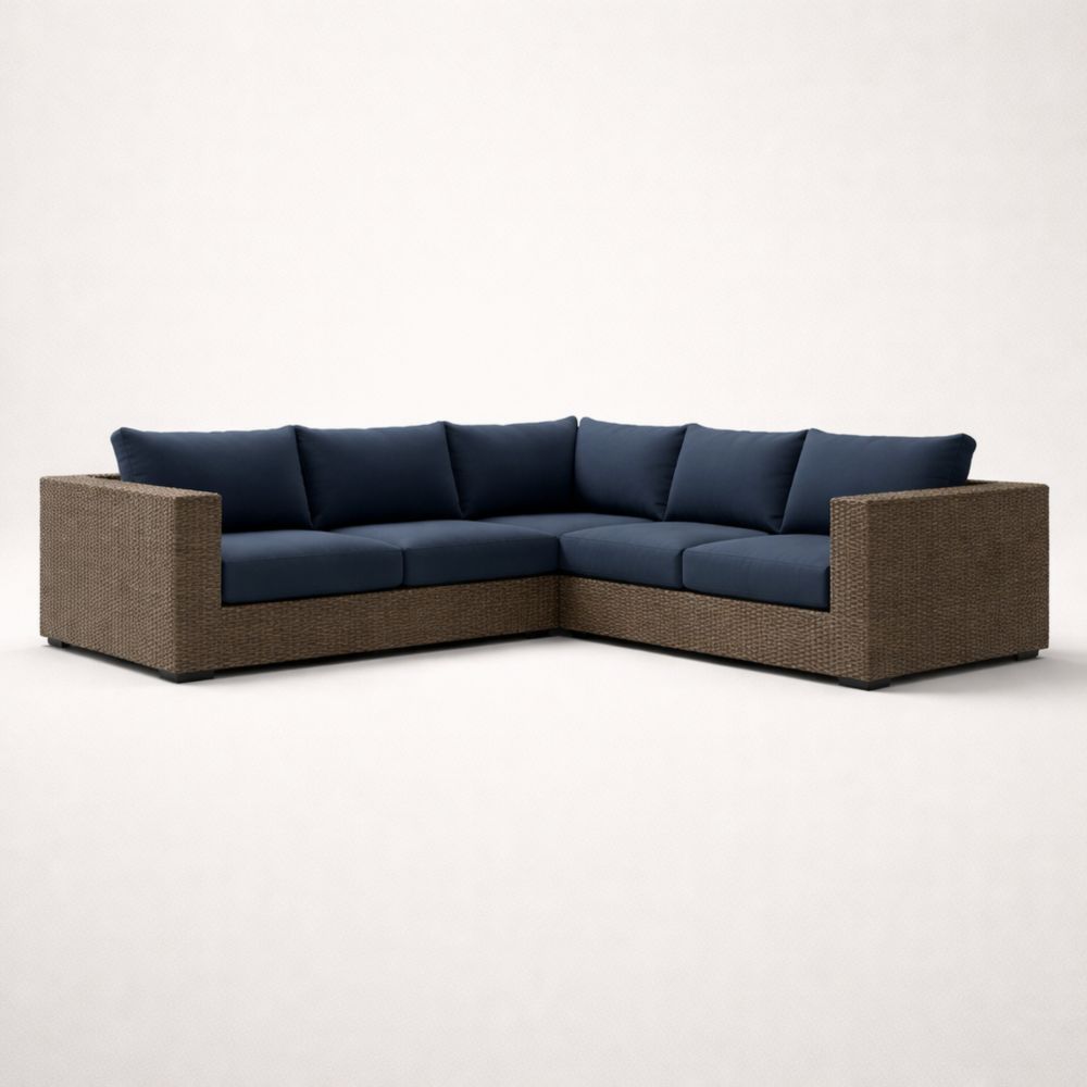 Canapé d'angle en rotin avec coussins en tissu bleu