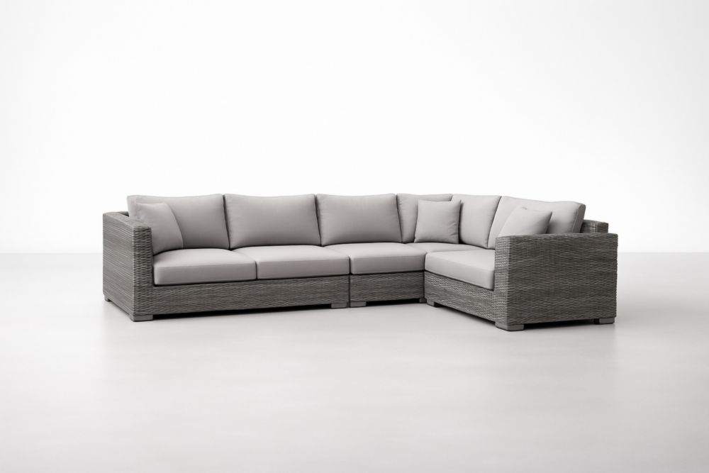 Canapé d'angle gris en résine tressée et coussins en polyester