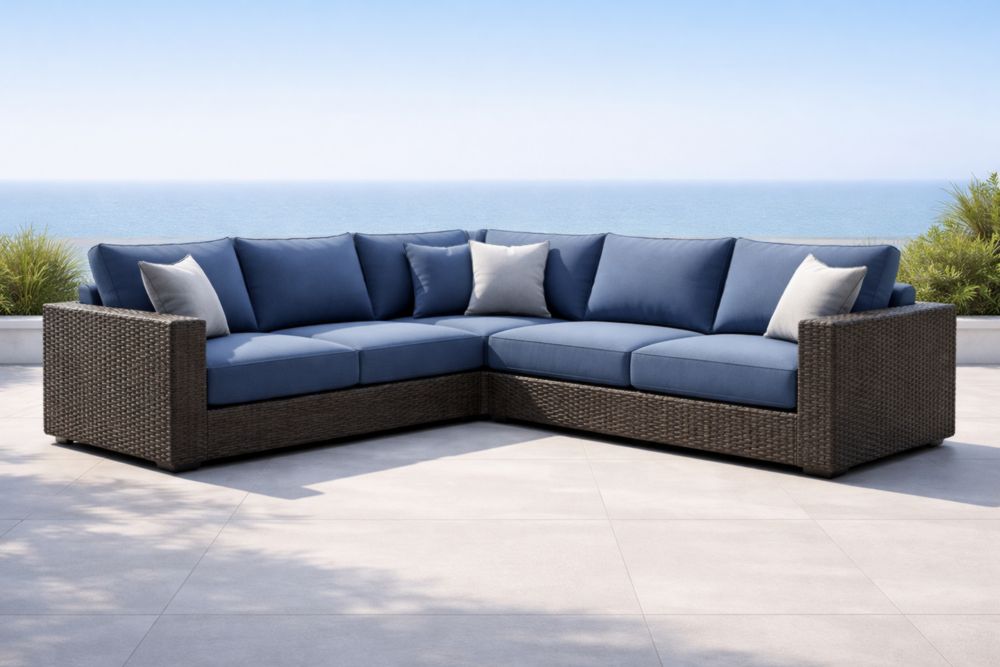 Divano angolare da esterno in rattan con cuscini blu