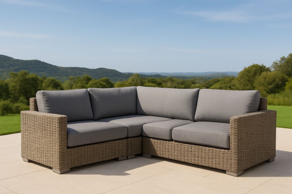 Divano angolare da esterno in rattan sintetico con cuscini grigi