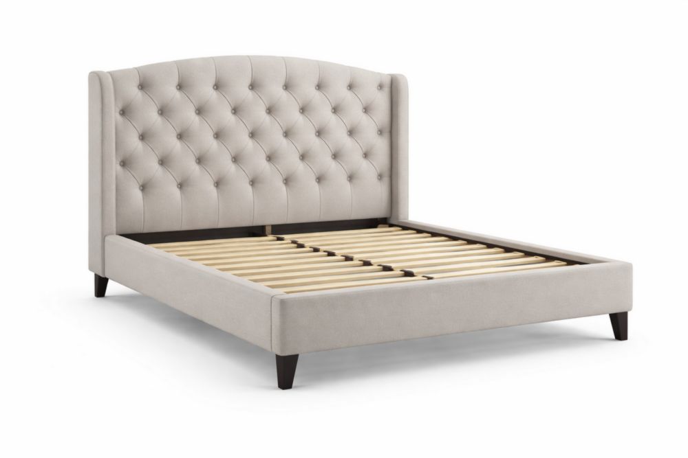 Lit double en tissu beige tête de lit capitonnée