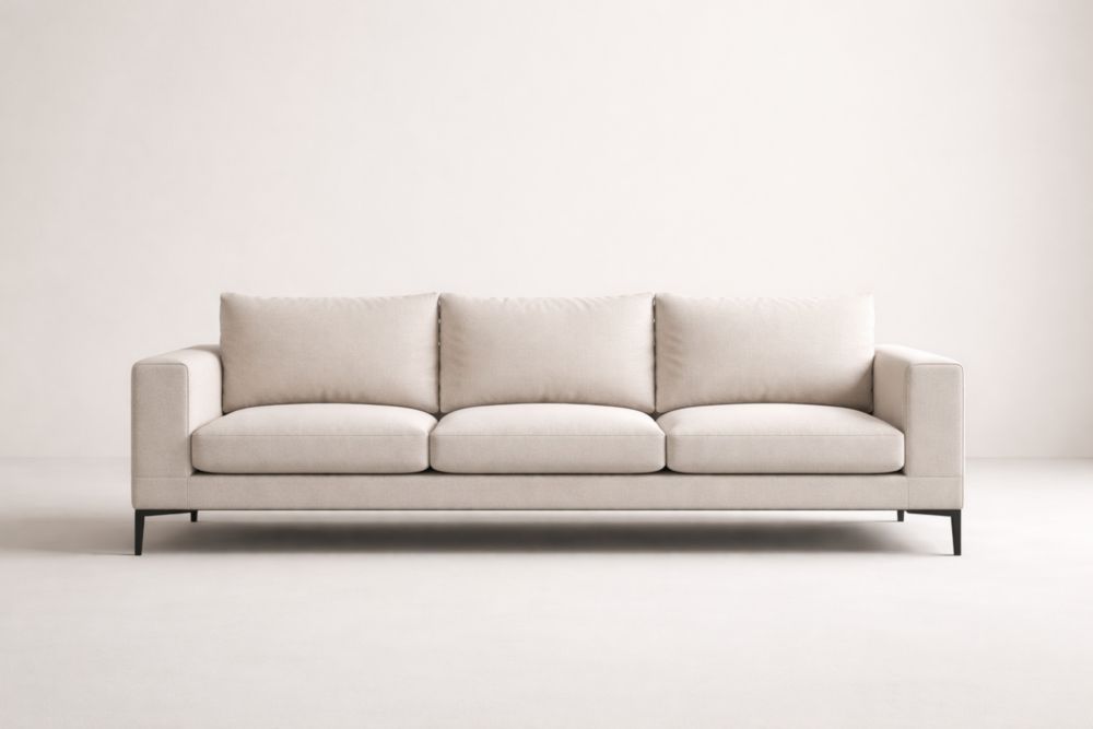 Divano lungo in tessuto beige con gambe in acciaio