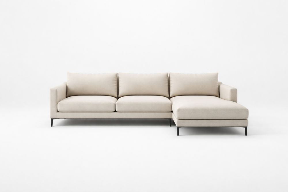 Divano angolare in tessuto beige con gambe in acciaio