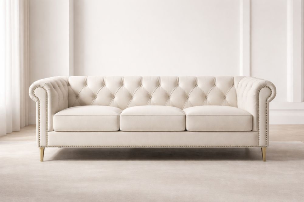 Divano in velluto con bottoni decorativi crema