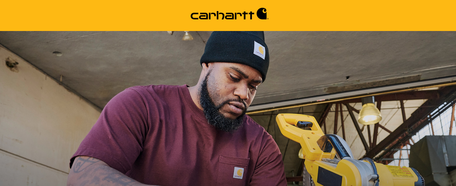 Carhartt Image man wearing black comfortable beanie and maroon pocket tee working with power tools