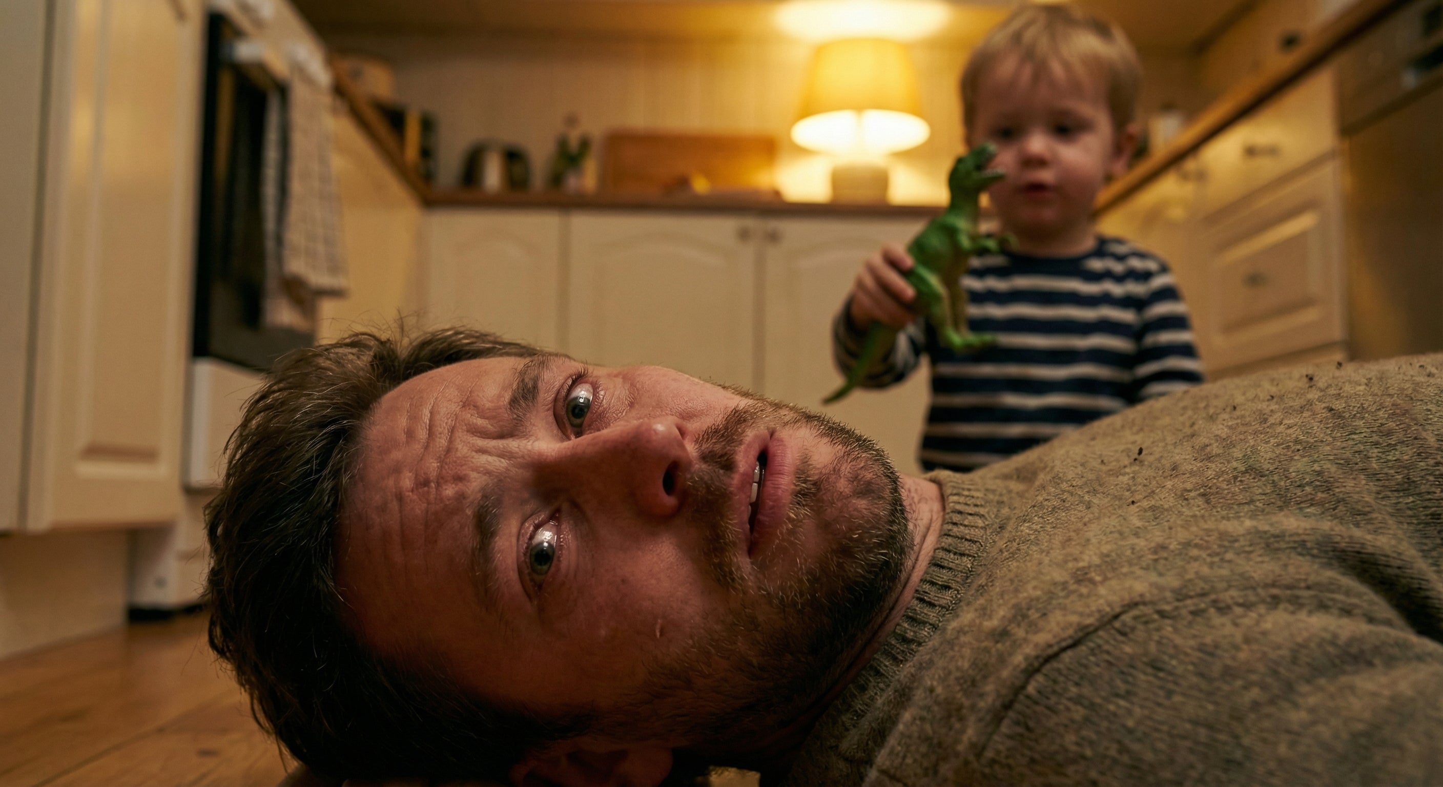 Father's face showing pain while child watches
