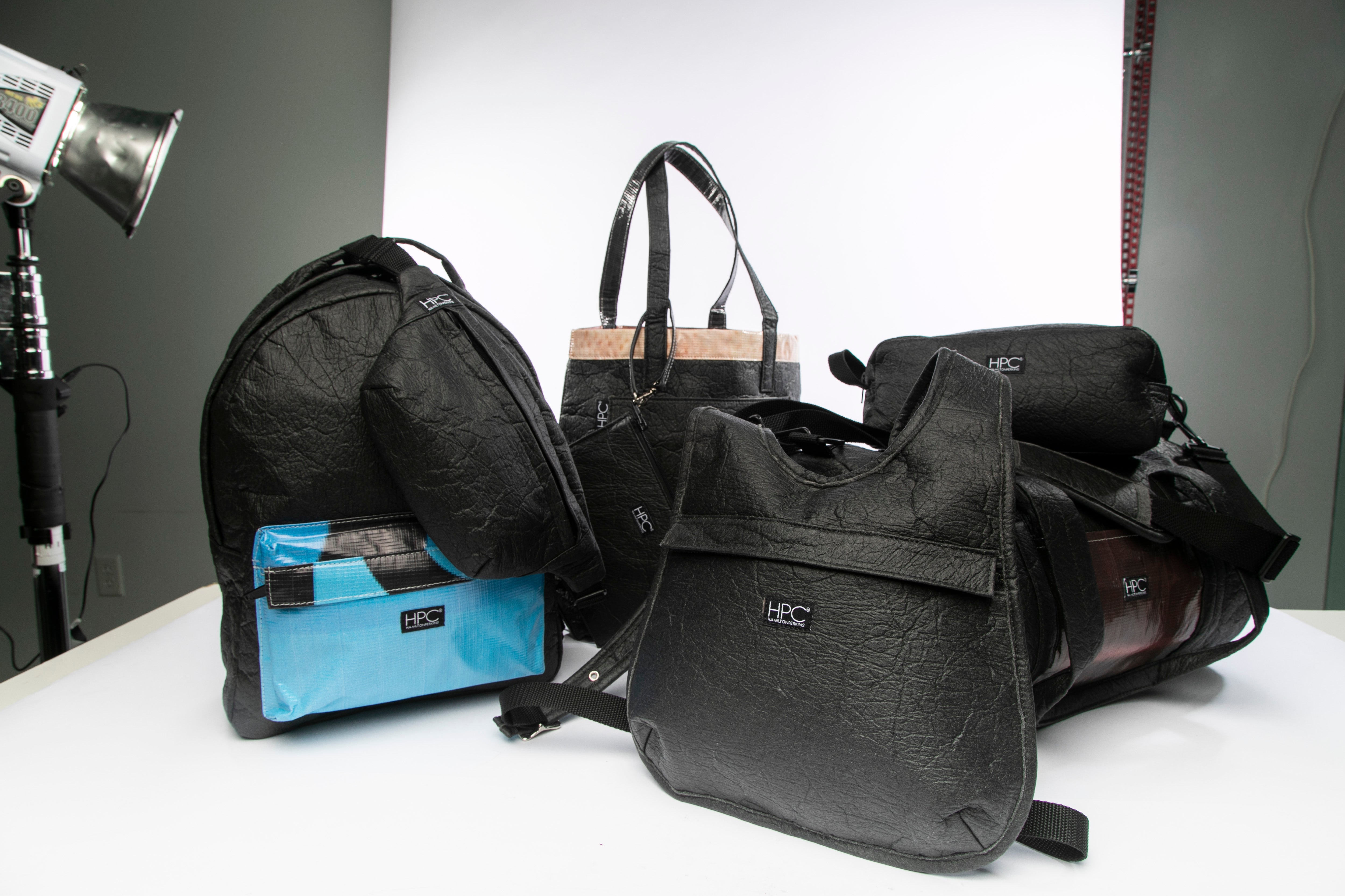 Bags made from retired billboard vinyl