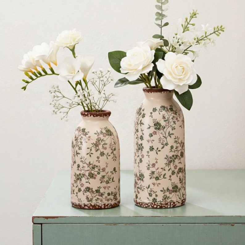 Handmade vintage floral ceramic vase, rustic farmhouse style, suitable for dried flower decoration.