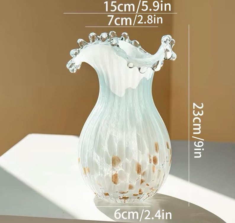Elegant glass vase with ceramic flowers, home decor