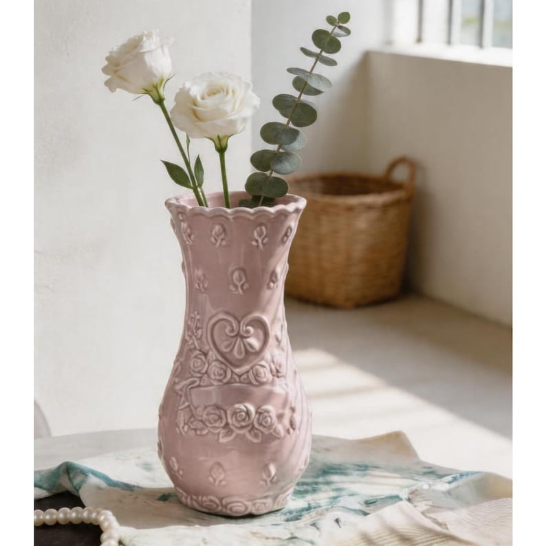 Pink ceramic Porcelain vase with embossed heart pattern and ruffled rim.